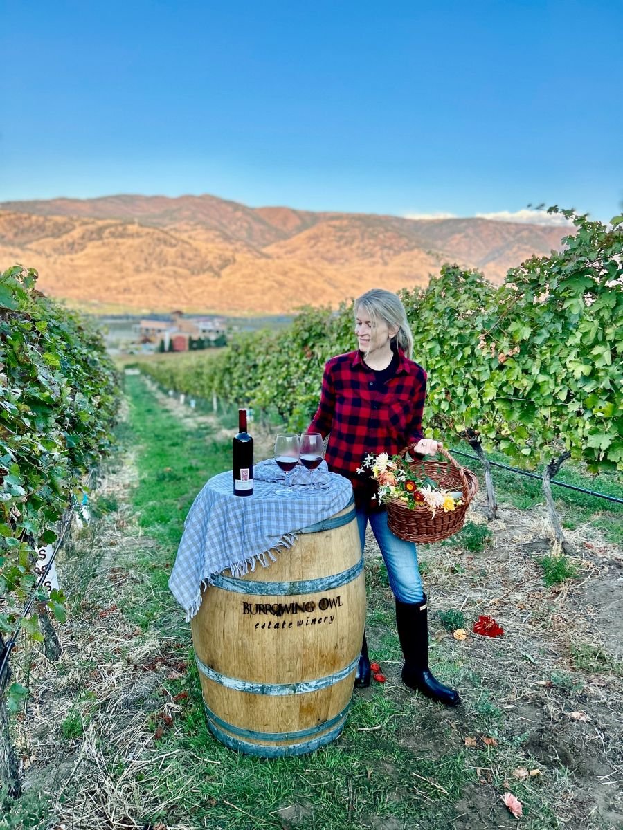 <who>Photo credit: Burrowing Owl Winery</who>Author and photographer Jennifer Schell Lirag sets up the front-cover shot for the Burrowing Owl Estate Winery Cookbook: Recipes for a Good Life.